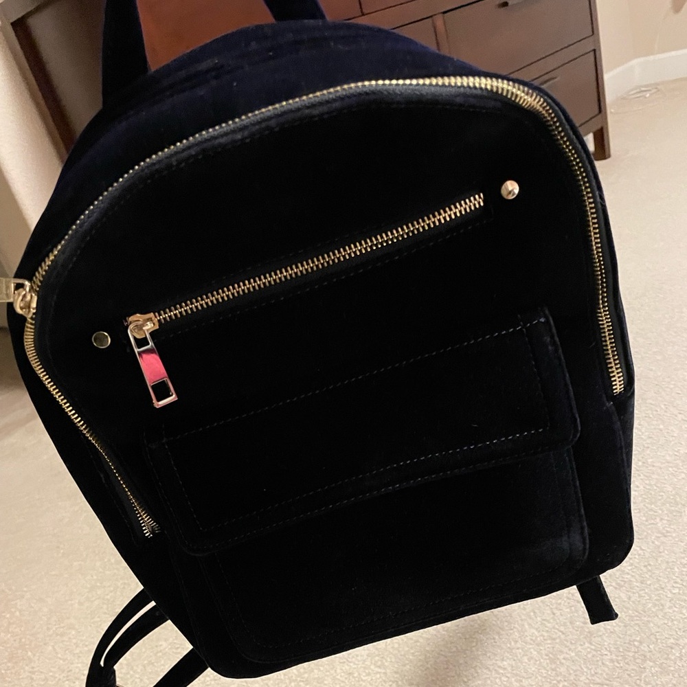GAP backpack navy blue color with golden zipper. Soft fabric dimensions is 12x10